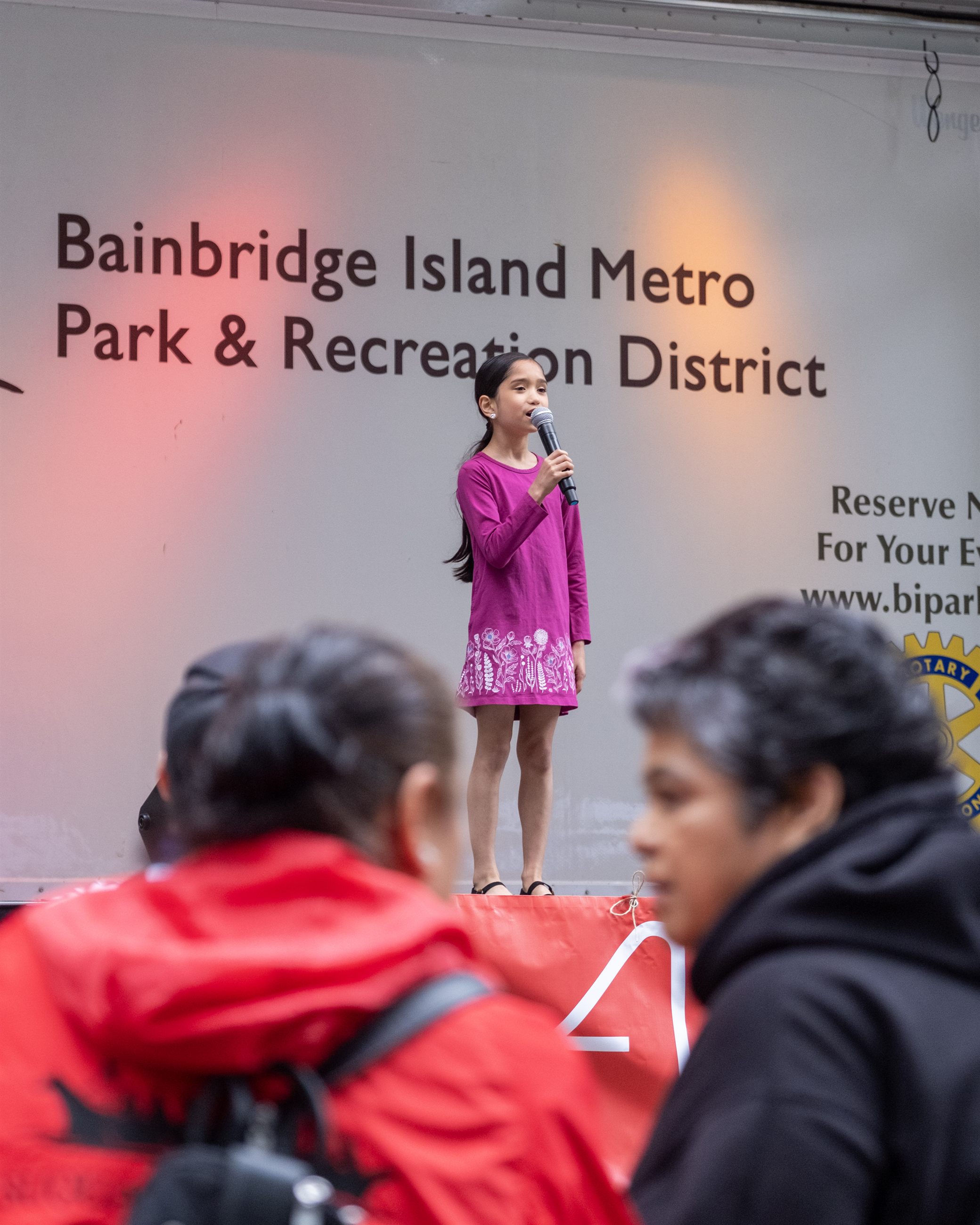 Festival food vendors serving attendees.