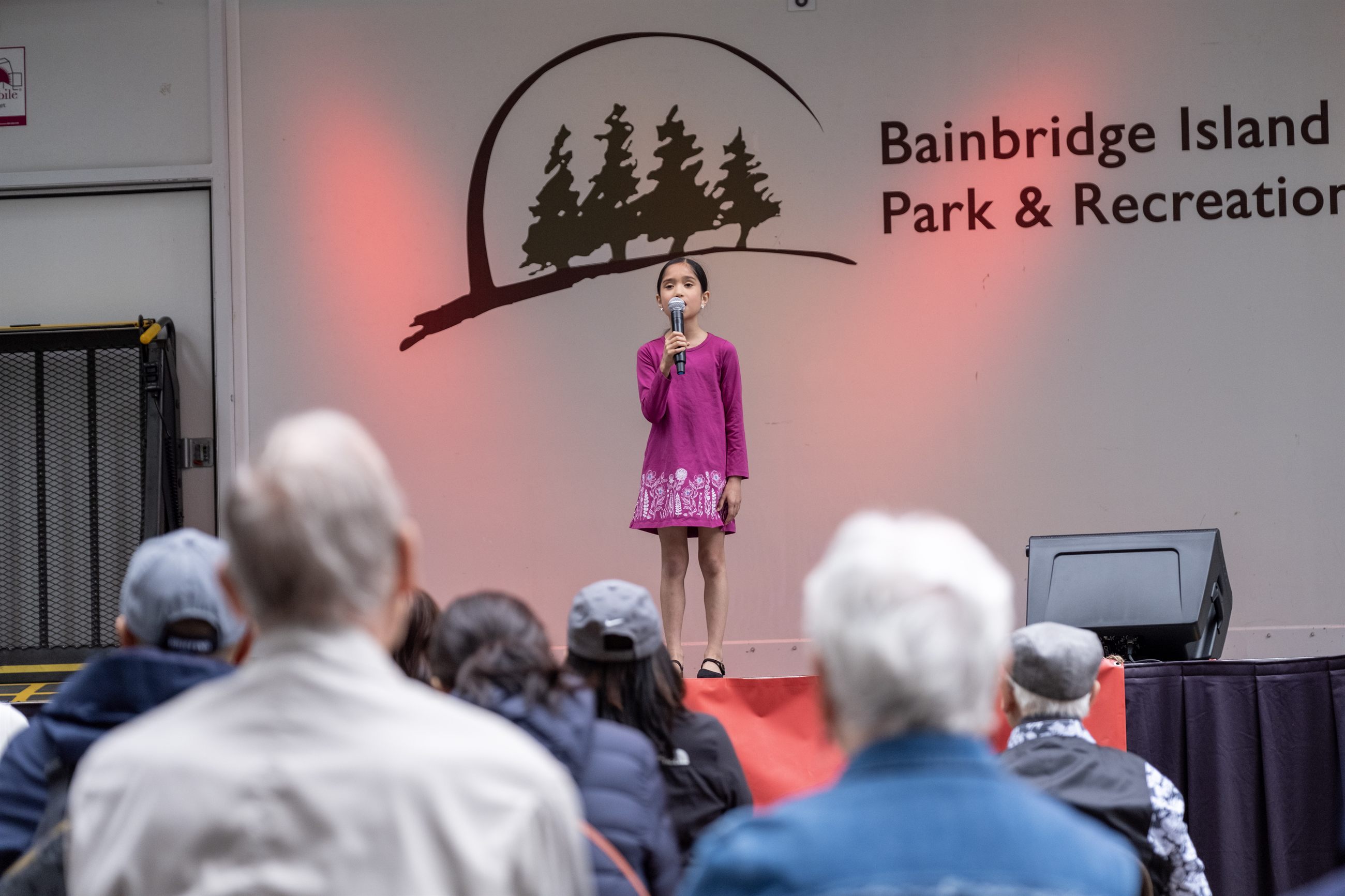 Arts & Humanities Bainbridge community gathering at a festival program.