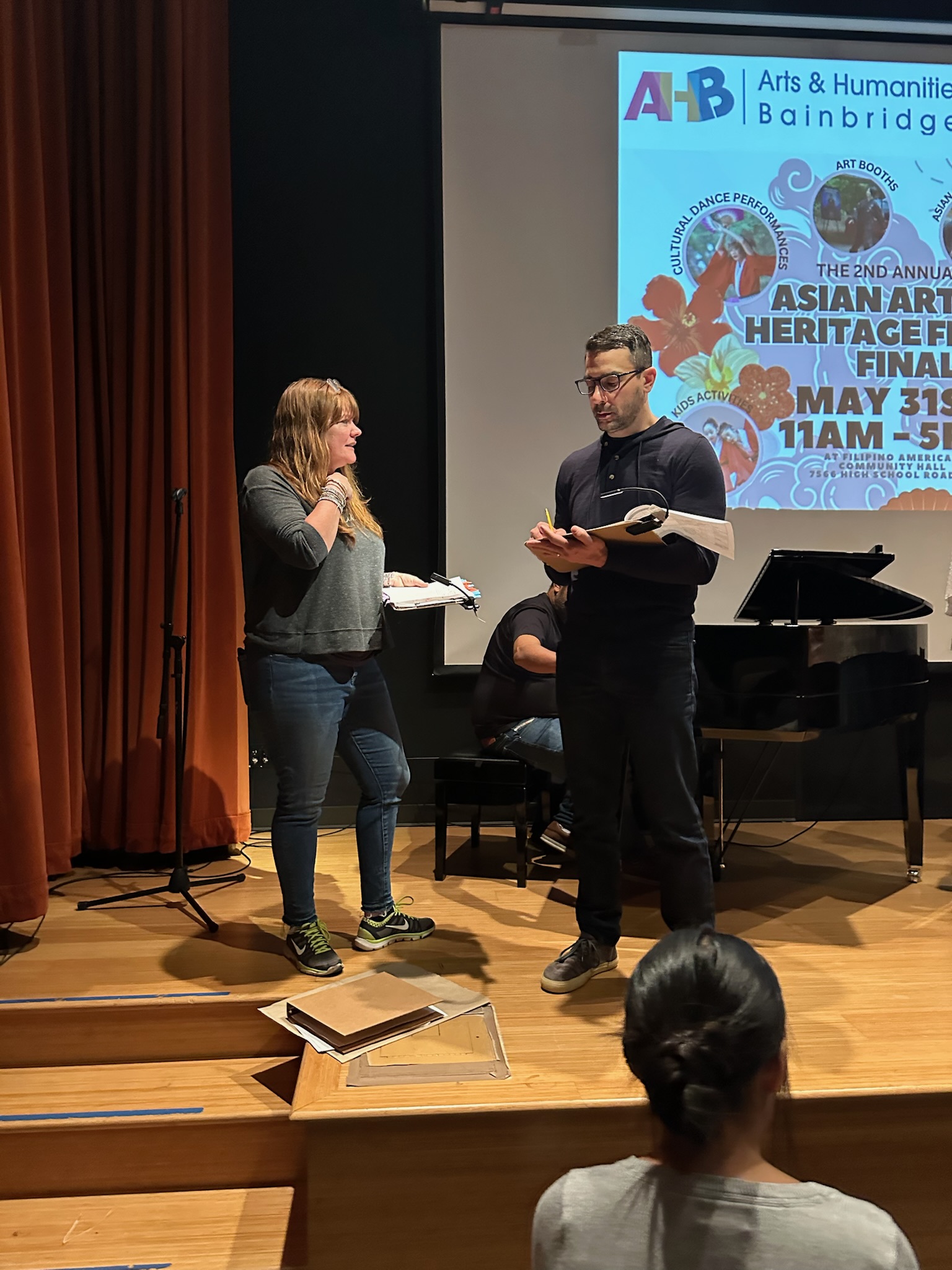 Volunteer production and operations team coordinating shift responsibilities.